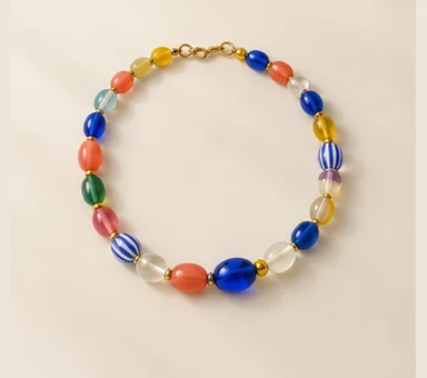 Short necklace with colorful oval beads and a gold-tone clasp