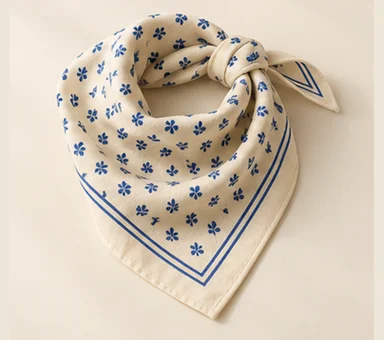 Cream bandana with a small blue motif and border